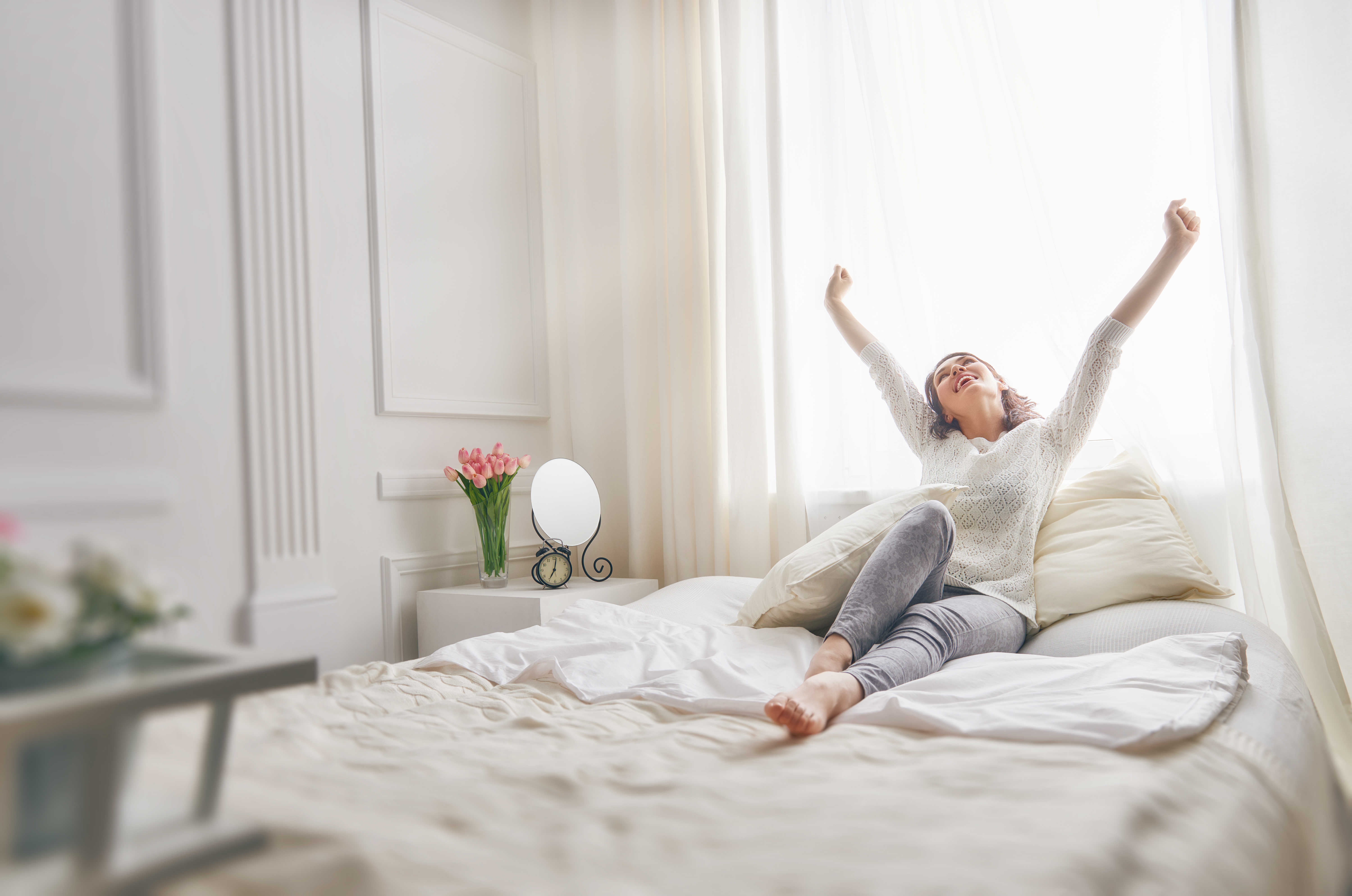 Rewards-of-a-Business-Opportunity_woman-relaxing-in-bedroom-at-Royal-Oceancrest