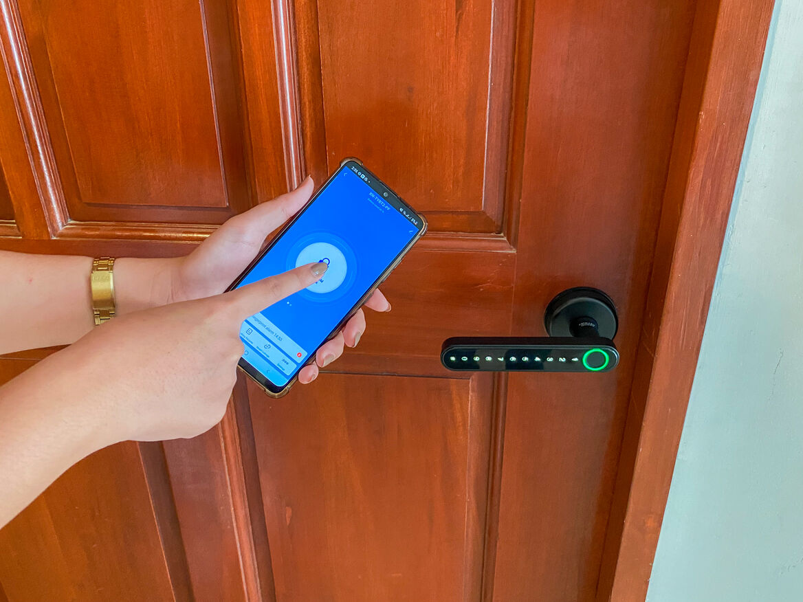 Unlocking the smart door lock through the phone at Royal Oceancrest Panglao 2