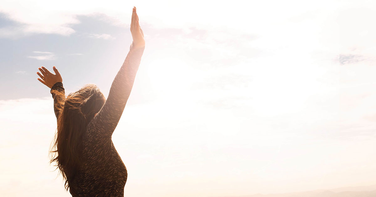 photo-of-woman-raising-both-hands